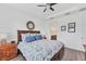 Primary bedroom view featuring hardwood floors and ceiling fan at 8721 Trattoria Ter, Sarasota, FL 34238
