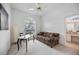 Inviting bedroom with a desk area, comfortable sofa, and ensuite bathroom access at 8824 Havenridge Dr, Sarasota, FL 34238