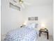 This bright bedroom offers neutral colors, a ceiling fan, and accents with artwork at 8824 Havenridge Dr, Sarasota, FL 34238