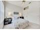 Charming bedroom featuring neutral walls and a ceiling fan, with storage shelves and a window at 8824 Havenridge Dr, Sarasota, FL 34238