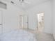 Bright bedroom featuring a ceiling fan and view into multiple other rooms at 8824 Havenridge Dr, Sarasota, FL 34238