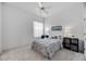Cozy bedroom with a ceiling fan, neutral walls, and window for natural light at 8824 Havenridge Dr, Sarasota, FL 34238