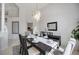Dining room featuring modern chandelier and decor, accentuating the dining table setting at 8824 Havenridge Dr, Sarasota, FL 34238