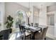 Bright dining room with high ceilings, decorative lighting, and a large window that provides ample natural light at 8824 Havenridge Dr, Sarasota, FL 34238