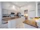 Well-lit kitchen featuring an open design, granite countertops, and modern stainless steel appliances at 8824 Havenridge Dr, Sarasota, FL 34238