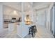 Open concept kitchen with granite countertops, white cabinets, stainless steel appliances, and center island at 8824 Havenridge Dr, Sarasota, FL 34238