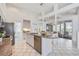 Modern kitchen with stainless steel appliances and granite countertops, open to backyard patio at 8824 Havenridge Dr, Sarasota, FL 34238
