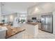 Bright kitchen features granite countertops, white cabinets, stainless appliances, and ample natural light at 8824 Havenridge Dr, Sarasota, FL 34238
