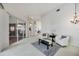 Open-concept living area with sliding glass doors, plush seating, and seamless flow into other living areas at 8824 Havenridge Dr, Sarasota, FL 34238
