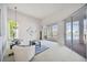 Bright living room featuring plush seating, elegant decor, and sliding glass doors to the outdoor living area at 8824 Havenridge Dr, Sarasota, FL 34238