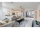 Bright living room with vaulted ceilings, neutral decor, and access to the screened lanai and pool at 8824 Havenridge Dr, Sarasota, FL 34238