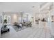 Open concept living area with vaulted ceilings, white walls, and seamless flow to the kitchen at 8824 Havenridge Dr, Sarasota, FL 34238