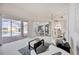 Bright living room with sliding doors to lanai and pool, featuring plush seating and open layout at 8824 Havenridge Dr, Sarasota, FL 34238