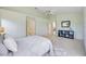 Relaxing main bedroom featuring a large bed, plush carpet, and access to ensuite bathroom at 8824 Havenridge Dr, Sarasota, FL 34238