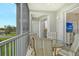 Outdoor balcony with a table and chairs offering a view of the surrounding community at 9630 Club South Cir # 6209, Sarasota, FL 34238
