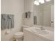Bright bathroom featuring a large mirror, extended counter, and updated fixtures with a walk-in shower at 9630 Club South Cir # 6209, Sarasota, FL 34238