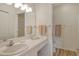 Bright bathroom featuring a large mirror, extended counter, and updated fixtures with a walk-in shower at 9630 Club South Cir # 6209, Sarasota, FL 34238