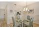 Bright dining room with a glass table and a modern light fixture creating a comfortable atmosphere at 9630 Club South Cir # 6209, Sarasota, FL 34238