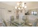 Bright dining room with a glass table and a modern light fixture creating a comfortable atmosphere at 9630 Club South Cir # 6209, Sarasota, FL 34238