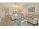 Comfortable living room with cozy seating and seamless access to the dining area at 9630 Club South Cir # 6209, Sarasota, FL 34238