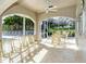 Spacious screened-in patio with seating, offering a beautiful space to unwind and enjoy the stunning views at 9630 Club South Cir # 6209, Sarasota, FL 34238