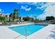Relax by the community pool with plenty of lounge chairs and landscaped surroundings on a sunny day at 9630 Club South Cir # 6209, Sarasota, FL 34238
