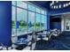 Bright dining area boasts floor-to-ceiling windows with views of the golf course at 9630 Club South Cir # 6209, Sarasota, FL 34238