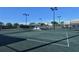 View of a tennis court with the lights on at 9630 Club South Cir # 6209, Sarasota, FL 34238