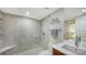 Bathroom with walk-in shower, vanity, and modern fixtures at 99 Sunset Dr # 102, Sarasota, FL 34236