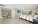 Bright bedroom featuring tile floors, contemporary furnishings, and television for comfortable living at 99 Sunset Dr # 102, Sarasota, FL 34236