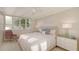 Cozy bedroom with large windows offering water views at 99 Sunset Dr # 102, Sarasota, FL 34236