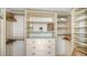Well-organized closet space with shelves and hanging rods providing ample storage at 99 Sunset Dr # 102, Sarasota, FL 34236