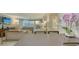 Bright living room featuring a sunset view of the water at 99 Sunset Dr # 102, Sarasota, FL 34236