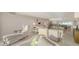 Bright living room features modern decor, comfortable seating, and seamless flow to the kitchen at 99 Sunset Dr # 102, Sarasota, FL 34236