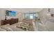 Elegant living room with panoramic water views, comfortable seating, and a stylish, modern design at 99 Sunset Dr # 102, Sarasota, FL 34236