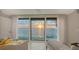 Water view through large window showcasing expansive water feature and calming decor at 99 Sunset Dr # 102, Sarasota, FL 34236