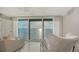 Water view through large window showcasing expansive water feature and calming decor at 99 Sunset Dr # 102, Sarasota, FL 34236