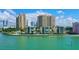 Beautiful waterfront condos with lush landscaping and serene water views create a relaxing atmosphere at 99 Sunset Dr # 102, Sarasota, FL 34236