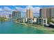 Scenic view of waterfront condos with easy water access and a clear view of the cityscape at 99 Sunset Dr # 102, Sarasota, FL 34236