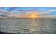 Beautiful waterfront view at sunset featuring calm waters and colorful skies at 99 Sunset Dr # 102, Sarasota, FL 34236