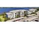 Stunning waterfront condo building featuring covered parking and manicured landscaping with beautiful water views at 1020 Tidewater Shores Loop # 304, Bradenton, FL 34208