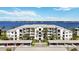 Gorgeous aerial view of waterfront condominium building in a beautiful community with palm trees at 1020 Tidewater Shores Loop # 304, Bradenton, FL 34208