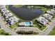 Aerial view of the community's pool, common area and a pond with fountains at 1020 Tidewater Shores Loop # 304, Bradenton, FL 34208