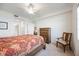Bedroom with standard closet, ceiling fan, and doorway to a second bedroom at 1020 Tidewater Shores Loop # 304, Bradenton, FL 34208