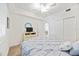 Bedroom featuring carpet, a ceiling fan, and doorway to a second room at 1020 Tidewater Shores Loop # 304, Bradenton, FL 34208