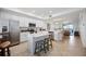 Open concept kitchen with white cabinetry, stainless steel appliances and a breakfast bar at 1020 Tidewater Shores Loop # 304, Bradenton, FL 34208