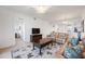 Bright living room featuring tile floors, neutral walls and comfortable leather seating at 1020 Tidewater Shores Loop # 304, Bradenton, FL 34208