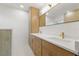 Bathroom with double sinks, quartz countertop, and golden faucets at 1050 55Th S Ave, St Petersburg, FL 33705