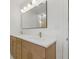 Bathroom featuring a double vanity, modern fixtures, and a large mirror with Hollywood-style lighting at 1050 55Th S Ave, St Petersburg, FL 33705