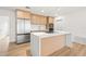 A spacious kitchen with a modern island, perfect for meal prep, featuring stainless steel appliances and ample storage at 1050 55Th S Ave, St Petersburg, FL 33705